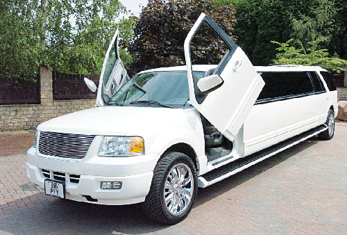 Chauffeur stretched white Ford Excursion 4x4 limo hire with Lamborghini doors in Sheffield, Rotherham, Barnsley, Doncaster, Huddersfield, South Yorkshire