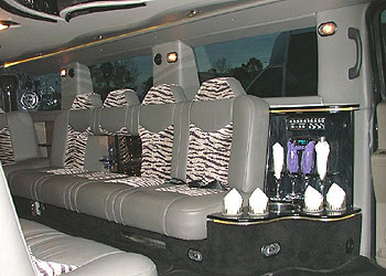 Chauffeur stretch silver Hummer limo hire in Birmingham, Coventry, Dudley, Wolverhampton, Telford, Worcester, Walsall, Stafford