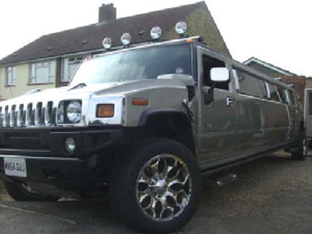 Chauffeur stretch gold Hummer H2 limo hire in Portsmouth, Southampton, Bournemouth, Brighton, Poole, Hampshire, Sussex, Surrey, South Coast