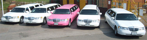 Chauffeur stretched fleet of white Lincoln limousine hire and pink Lincoln limo hire in UK