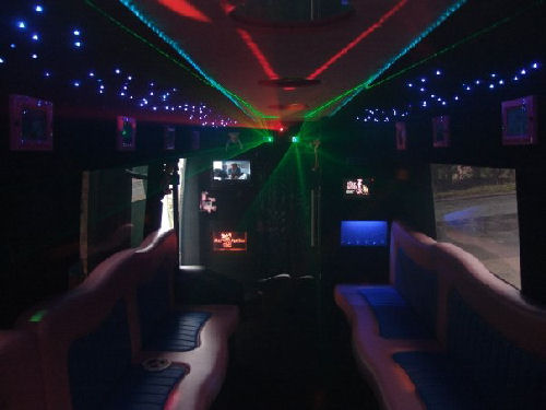 Chauffeur driven Pink Panther Party Bus limo hire interior in Birmingham, Coventry, Dudley, Wolverhampton, Telford, Worcester, Walsall, Stafford, Midlands