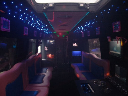 Chauffeur driven Pink Panther Party Bus limousine hire interior in Birmingham, Coventry, Dudley, Wolverhampton, Telford, Worcester, Walsall, Stafford, Midlands